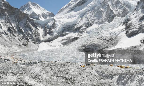 This photograph taken on April 26 shows the Khumbu glacier, one of the longest glaciers in the world and the Everest base camp, at the Everest region...