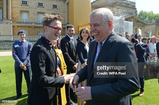 Prince Andrew, Duke of York talks to Tom Fletcher during a ceremony for the Duke of Edinburgh's Award in the gardens at Buckingham Palace on May 17,...