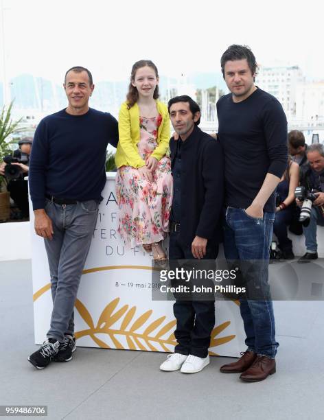 Actors Edoardo Pesce, Alida Baldari Calabria, director Matteo Garrone and actor Marcello Fonte attend the photocall for the "Dogman" during the 71st...