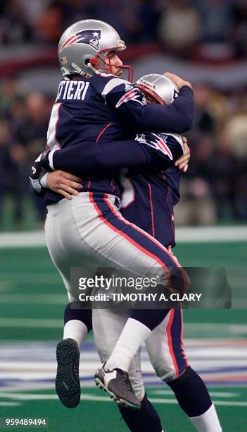 New England Patriots kicker Adam Vinatieri celebrates his game winning field goal with holder Ken Walter in the second half 03 February, 2002 at...