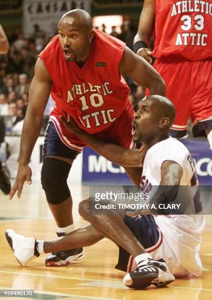 Tim Hardaway of the Red Team goes after a loose ball against Gary Payton of the White Team during the second period of "The Game on Showtime" at the...