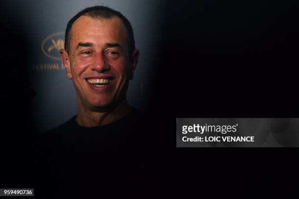 Italian director Matteo Garrone smiles on May 17, 2018 during a press conference for the film "Dogman" at the 71st edition of the Cannes Film...