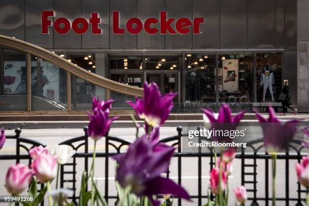 Pedestrian passes in front of a Foot Locker Inc. Store in downtown Chicago, Illinois, U.S., on Sunday, May 13, 2018. Foot Locker Inc. Is scheduled to...