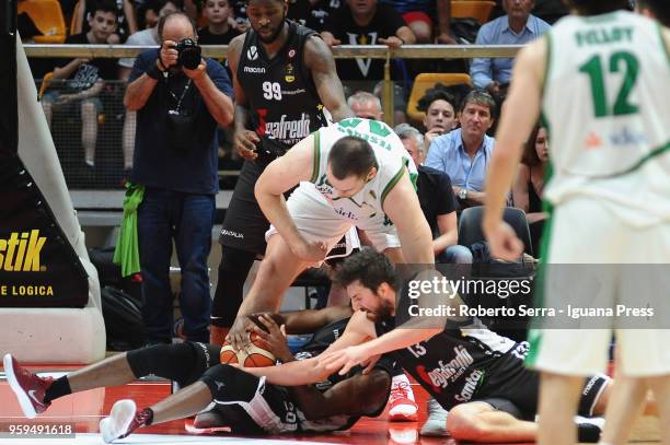 Kyrylo Fesenko of Sidigas competes with Jamil Wilson and Oliver Lafayette and Klaudio Ndoja of Segafredo during the LBA LegaBasket match between...