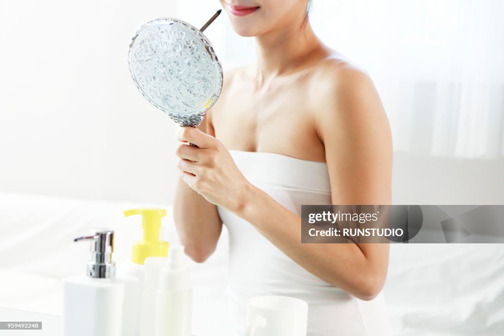 Woman holding eyeliner