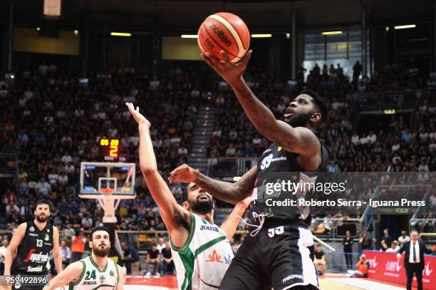 Jamil Wilson and Klaudio Ndoja of Segafredo competes with Thomas Scrubb and Lorenzo D'Ercole of Sidigas during the LBA LegaBasket match between...