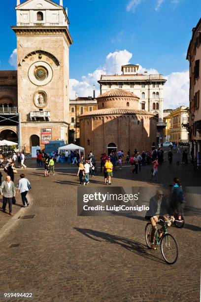 mantua: people, san lorenzo roundabout and clock tower - consiglio stock pictures, royalty-free photos & images
