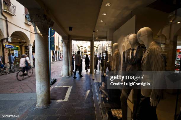 mantua: portici with people who park between shops and bars - consiglio stock pictures, royalty-free photos & images