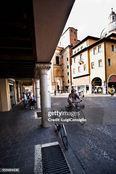 mantua: portici with people who park between shops and bars - consiglio stock pictures, royalty-free photos & images