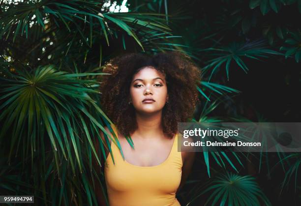 looking like a modern day mother nature - curly hair natural stock pictures, royalty-free photos & images