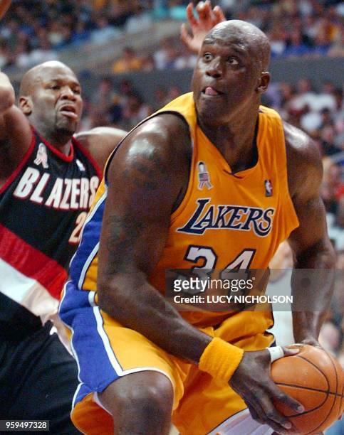 Los Angeles Lakers' Shaquille O'Neal goes up against Portland Trail Blazers' Ruben Patterson in the first half of Game 1 of their First Round NBA...