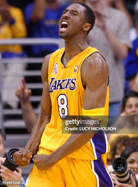 Los Angeles Lakers' Kobe Bryant celebrates after scoring against the Portland Trail Blazers in the last minutes of the final quarter of Game 1 of...