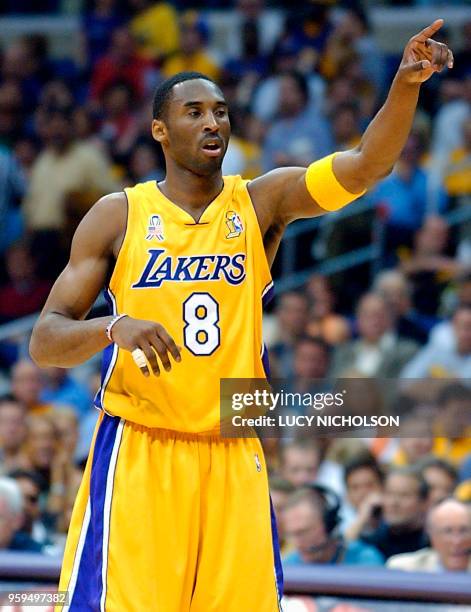 Kobe Bryant of the Los Angeles Lakers points down court against the New Jersey Nets in the 3rd quarter game two of the NBA Finals 07 June 2002, at...