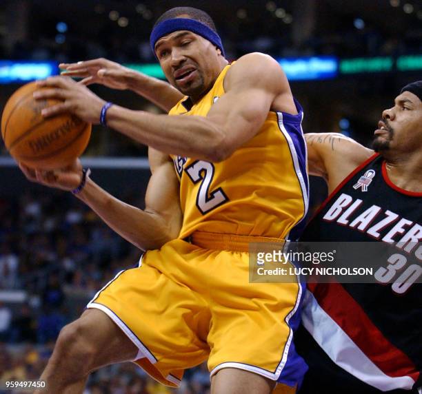 Los Angeles Lakers' Derek Fisher is fouled by Portland Trail Blazers' Rasheed Wallace in the second quarter of Game 1 of their First Round NBA...