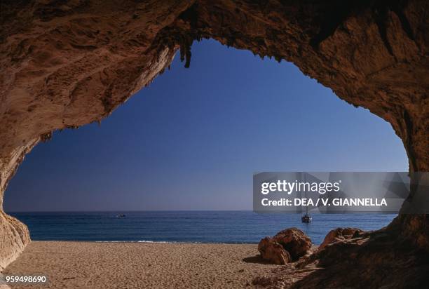 View from inside a cave on the beach of Cala Luna, National Park of the Bay of Orosei and Gennargentu, Ogliastra, Sardinia, Italy.