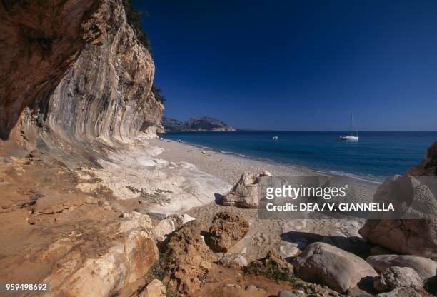 Cala Luna, beach and rock face, National Park of the Bay of Orosei and Gennargentu, Ogliastra, Sardinia, Italy.