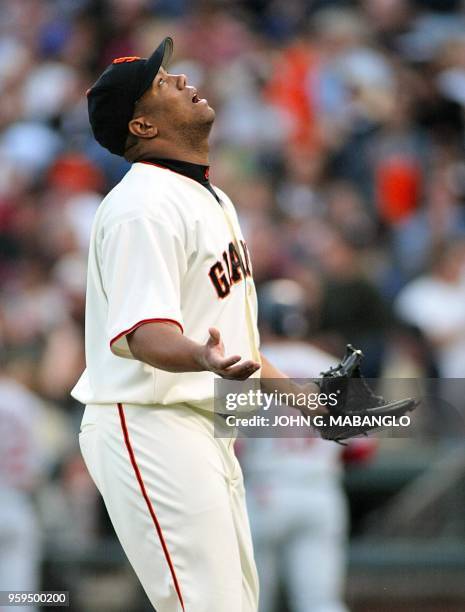 Starting pitcher Livan Hernandez of the San Francisco Giants walks to the dugout after the third inning against the St. Louis Cardinals 13 October...