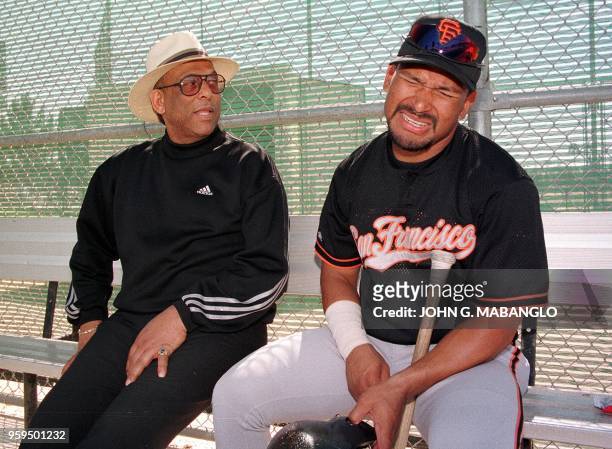 Former San Francisco Giants star Orlando Cepeda looks on as San Francisco Giants player Marvin Benard of Nicaragua reacts to a joke from Cepeda...
