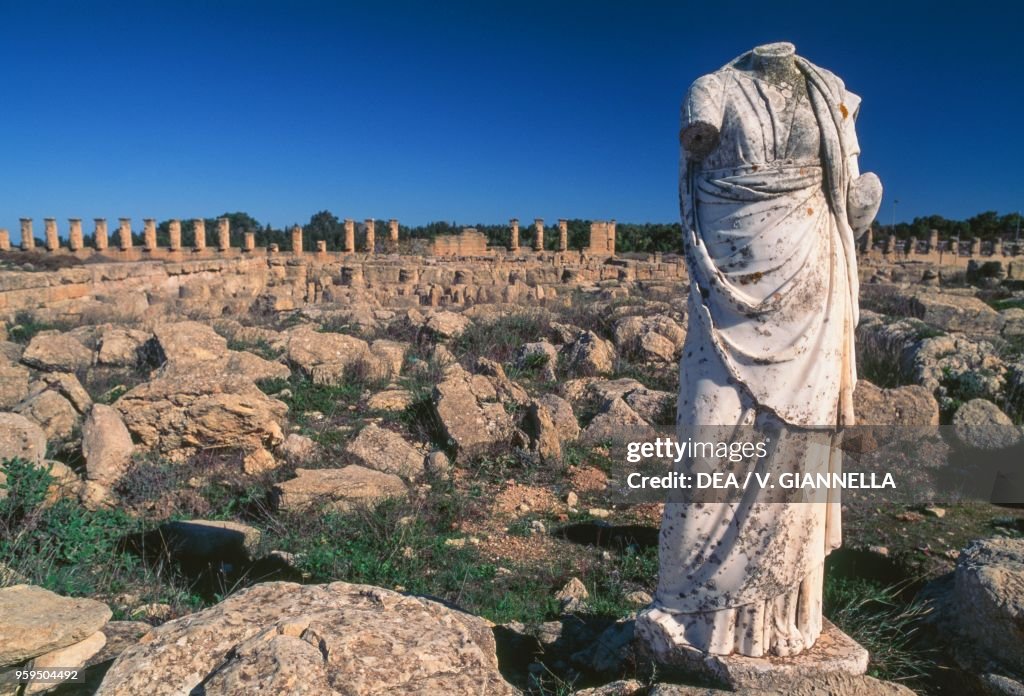 Female figure and ruins of houses, Cyrene