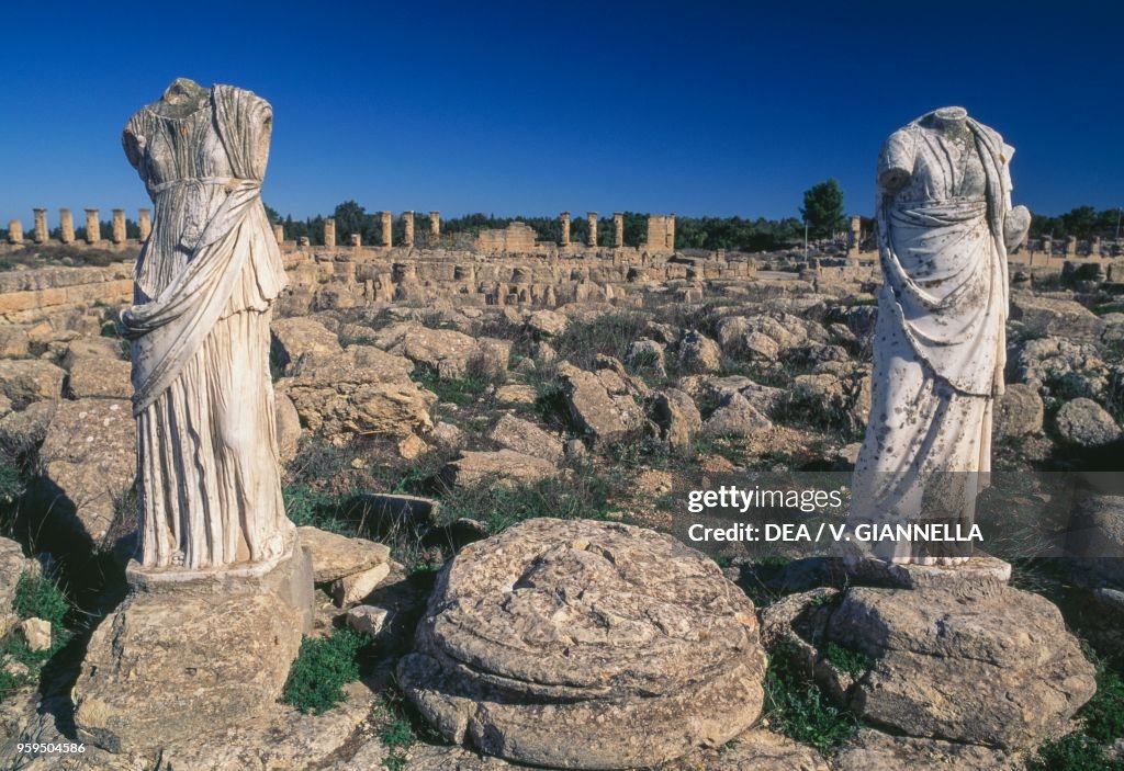 Female figures and ruins of houses, Cyrene