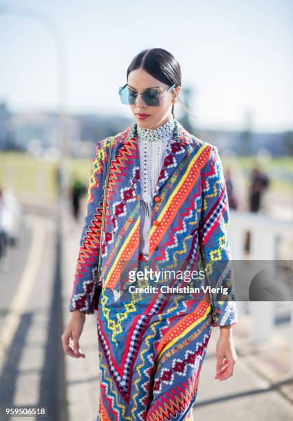 Guest wearing multi color jacket and pants during Mercedes-Benz Fashion Week Resort 19 Collections at Icebergs Dining Room on May 17, 2018 in Sydney,...