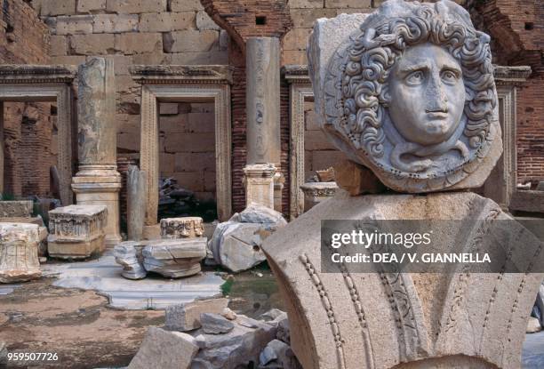 Gorgon head and and capitals in the shops area, Leptis Magna , Libya, Roman civilization, 2nd-3rd century.