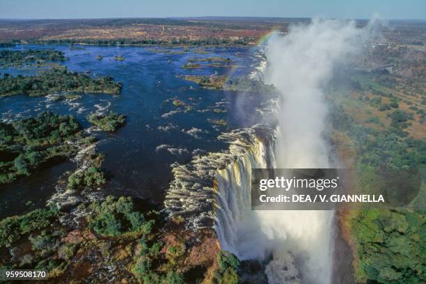 Aerial view of the Victoria Falls on the Zambezi River, Mosi-oa-Tunya National Park, Zambia, and Victoria Falls National Park, Zimbabwe.