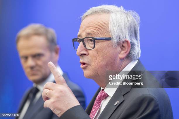 Jean-Claude Juncker, president of the European Commission, right, gestures while speaking beside Donald Tusk, president of the European Union ,...