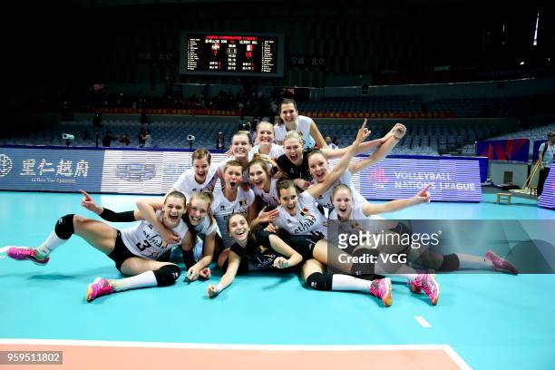 Players of Belgium celebrate after defeating the Dominican Republic during the FIVB Volleyball Nations League 2018 at Beilun Gymnasium on May 17,...