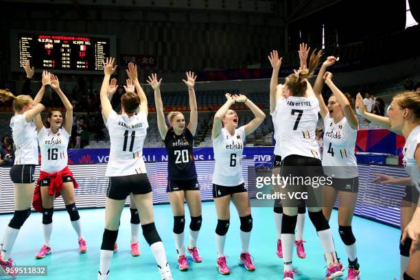 Players of Belgium celebrate after defeating the Dominican Republic during the FIVB Volleyball Nations League 2018 at Beilun Gymnasium on May 17,...