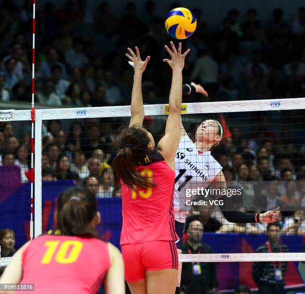 Linyu Diao of China defends against Su Ji Kim of South Korea during the FIVB Volleyball Nations League 2018 at Beilun Gymnasium on May 17, 2018 in...