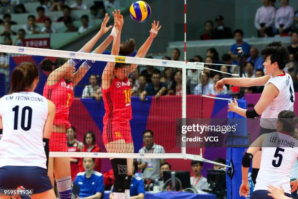 Xiaotong Liu of China defends against Heejin Kim of South Korea during the FIVB Volleyball Nations League 2018 at Beilun Gymnasium on May 17, 2018 in...