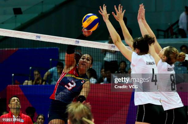 Nathalie Lemmens and Kaja Grobelna of Belgium defend against Lisvel Elisa Eve Mejia of the Dominican Republic during the FIVB Volleyball Nations...