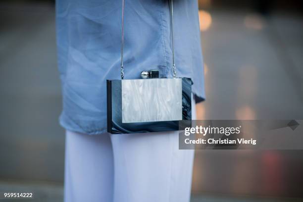 Guest wearing cropped top, white pants, button shirt during Mercedes-Benz Fashion Week Resort 19 Collections at Carriageworks on May 17, 2018 in...