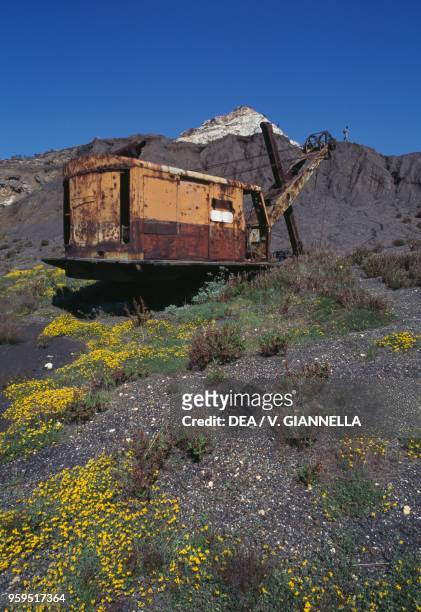 Abandoned mining machinery in a quarry at Capo Calamita, Elba, Tuscan Archipelago National Park, Tuscany, Italy.