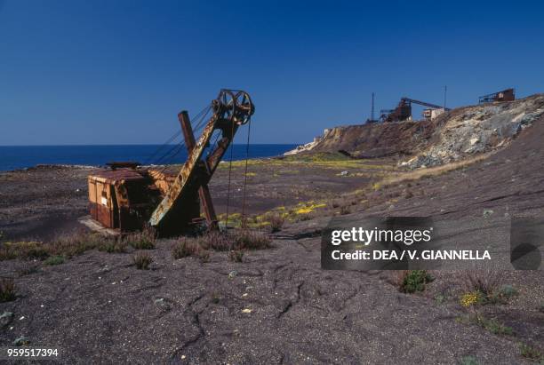 Abandoned mining machinery in a quarry at Capo Calamita, Elba, Tuscan Archipelago National Park, Tuscany, Italy.