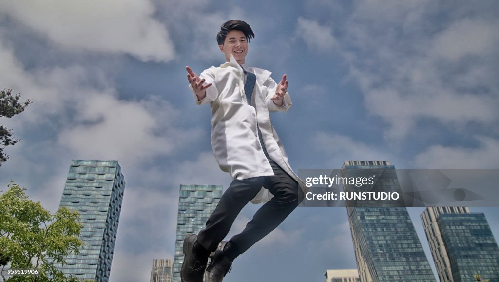 Portrait of smiling doctor jumping