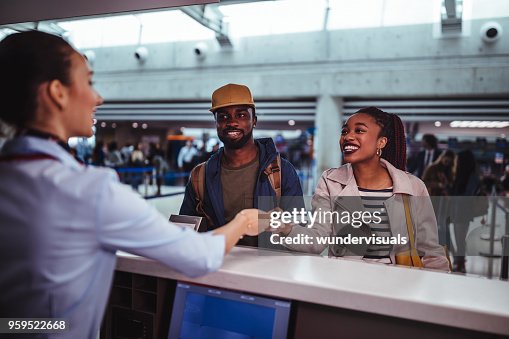 Check In For A Flight Young Passengers Doing Checkin For Flight At Airport High-Res Stock ...
