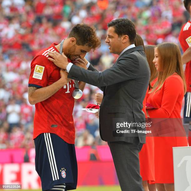 Javi Martinez of Muenchen receives his medal after the Bundesliga match between FC Bayern Muenchen and VfB Stuttgart at Allianz Arena on May 12, 2018...