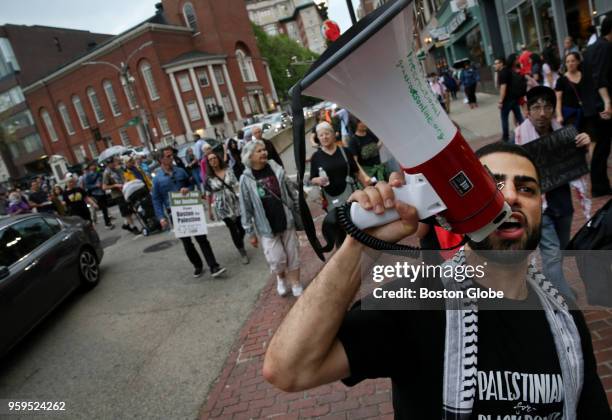 Nasir Almasri, of the Palestinian Community of Boston, leads demonstrators to the Cathedral Church of St. Paul during a rally in Boston on May 15,...