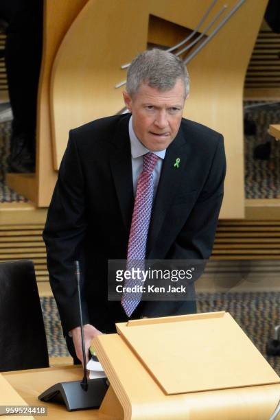 Scottish Liberal Democrat leader Willie Rennie takes his seat for First Minister's Questions in the Scottish Parliament on May 17, 2018 in Edinburgh,...