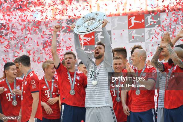 Goalkeeper Sven Ulreich of Muenchen celebrates winning the championship after the Bundesliga match between FC Bayern Muenchen and VfB Stuttgart at...