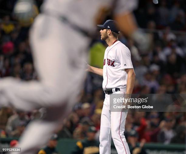 Boston Red Sox starting pitcher Chris Sale waits for a new baseball after Oakland's Marcus Semien had just hit a top of the fifth inning two-run home...