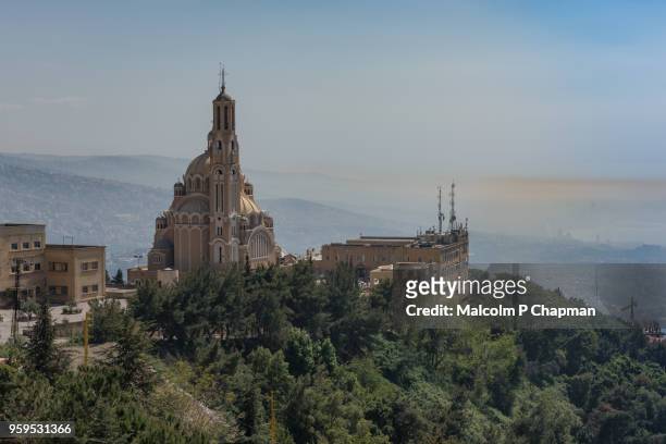 cathedral of st paul and view towards beirut (in haze) from harissa, jounieh, lebanon - malcolm hill fotografías e imágenes de stock