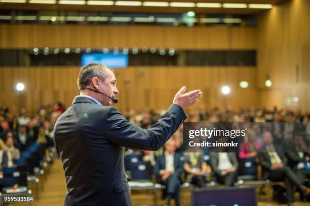 business people in seminar at auditorium - conference event stage stock pictures, royalty-free photos & images