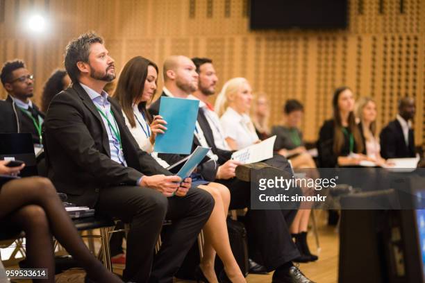 business people in seminar at auditorium - business formal stock pictures, royalty-free photos & images