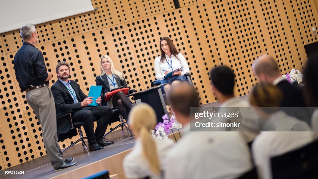 Business people in seminar at auditorium