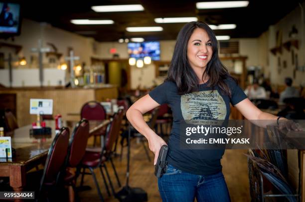 Owner Lauren Boebert poses for a portrait at Shooters Grill in Rifle, Colorado on April 24, 2018. - Lauren Boebert opened Shooters Grill in 2013 with...