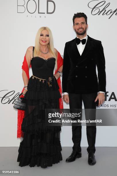 Monika Bacardi and Andrea Iervolino arrive at the amfAR Gala Cannes 2018 at Hotel du Cap-Eden-Roc on May 17, 2018 in Cap d'Antibes, France.