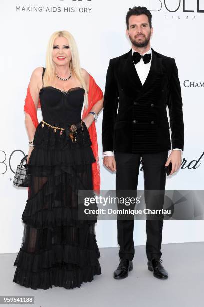 Monika Bacardi and Andrea Iervolino arrive at the amfAR Gala Cannes 2018 at Hotel du Cap-Eden-Roc on May 17, 2018 in Cap d'Antibes, France.